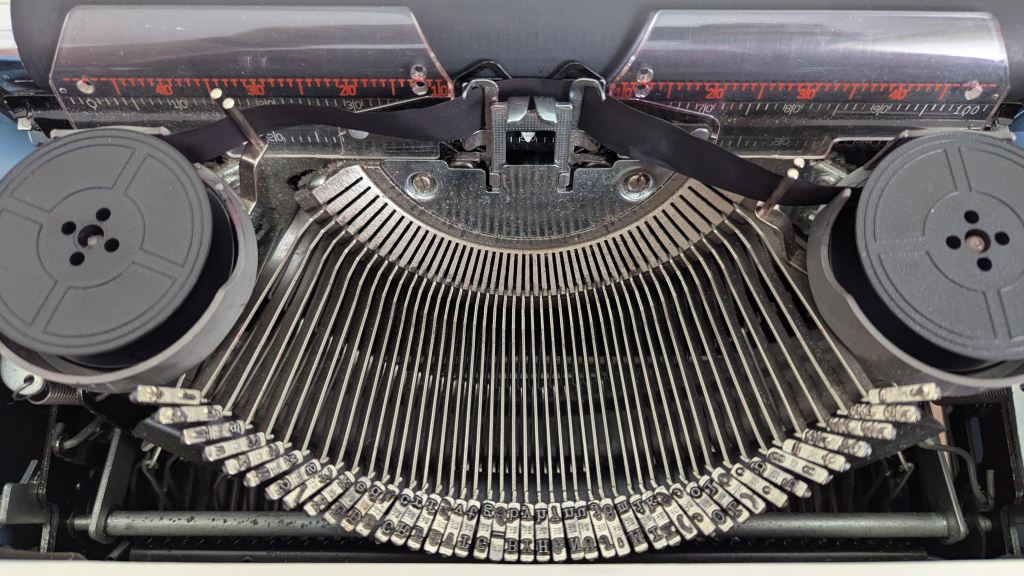 Close-up of the basket of a typewriter (the bit with the hammers)